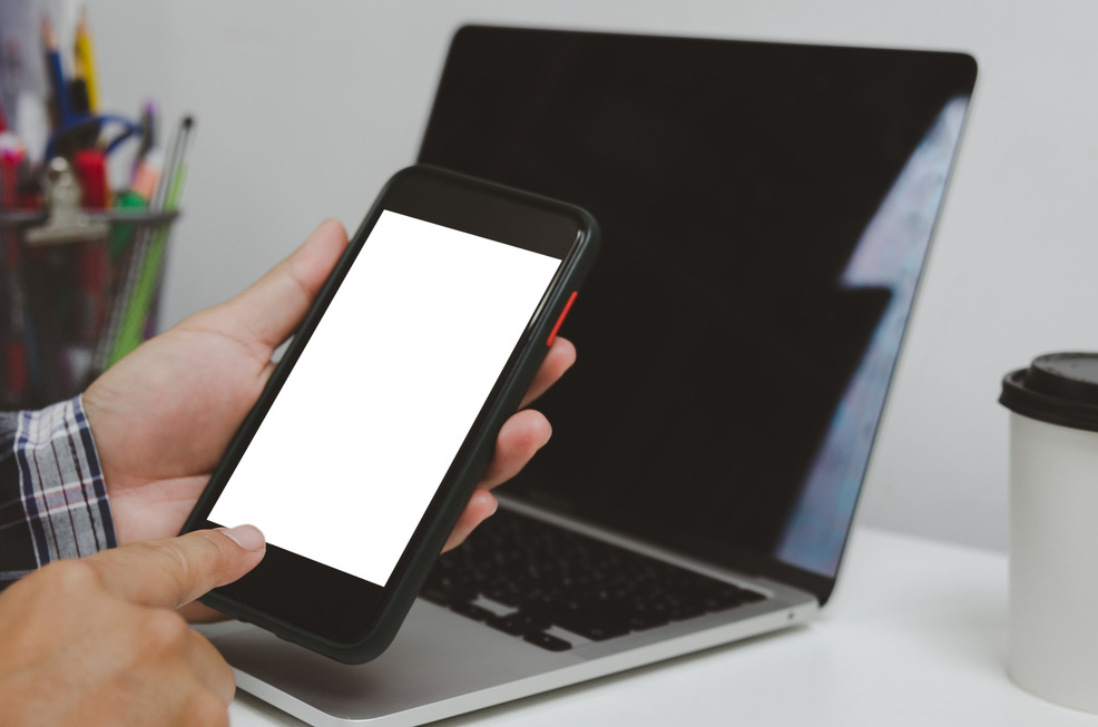 Hand man holding mobile smartphone network digital technology on